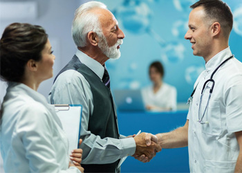 Doctor shaking hand with patient